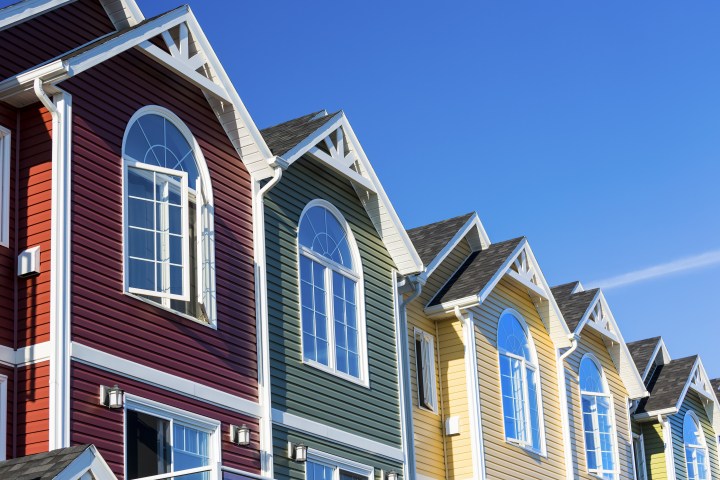A row of colorful new townhouses or condominiums.